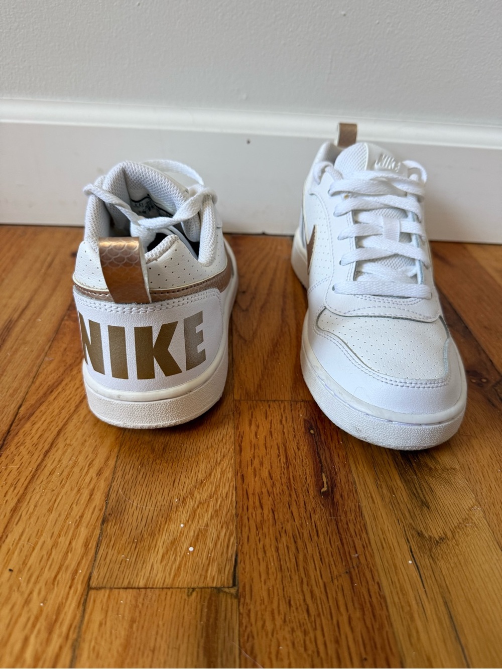 Nike Kids White Sneakers with Gold Accents